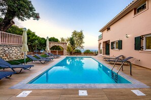 Seasonal outdoor pool, pool umbrellas, sun loungers