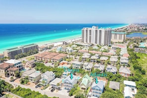 An aerial view of a coastal resort area with two prominent buildings labeled 'Utopia' and 'Atlantis'. - Utopia Estate with Saltwater Pool & Golf Cart (Miramar Beach)