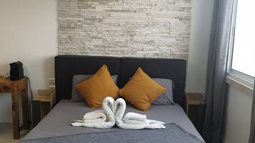 Superior Studio Suite, 1 Queen Bed, Kitchen, Sea View | Premium bedding, individually decorated, individually furnished, desk