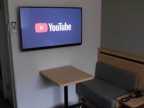 Enjoy a comfortable stay with a flat-screen TV, dining area, sofa, and telephone.