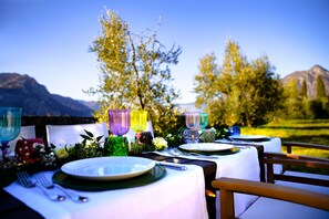 Enjoy al fresco dining with a breathtaking view of the surrounding landscape.