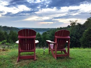 Property grounds - 1800’s restored log cabin on 26 private rolling wooded acres with sunset views (Madison)