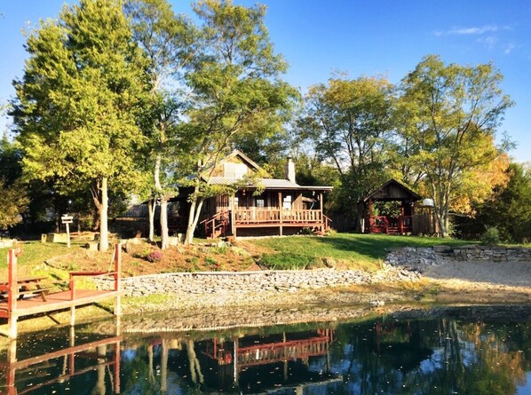 Exterior - 1800’s restored log cabin on 26 private rolling wooded acres with sunset views (Madison)