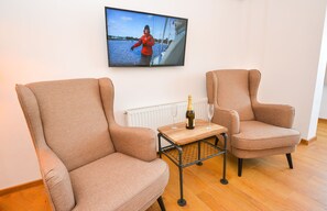 Estudio, 1 habitación, vista a la ciudad | Área de sala de estar