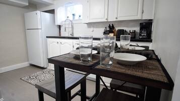 Apartment, Multiple Beds (915 23rd St. - Lower) | Private kitchen | Full-sized fridge, oven, stovetop, coffee/tea maker