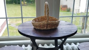 A room with a large window, a wicker basket on a table, and a radiator below. - Serenity in lancaster county (Paradise)