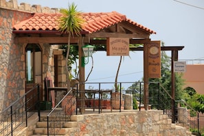 Step into this charming coffeehouse with a rustic facade and inviting entrance.