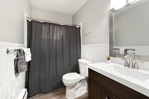 Combined shower/bathtub, hair dryer, towels, soap