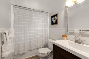 Condo, Multiple Beds (220 Peterson St. (Unit 1)) | Bathroom | Combined shower/bathtub, hair dryer, towels, soap - Contemporary condo in the heart of Old Town (Fort Collins)