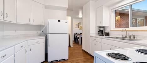 Fridge, coffee/tea maker, toaster, cookware/dishes/utensils