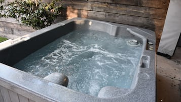 Relax in a hot tub with a soothing bubble bath.