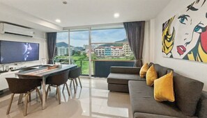 Condo, 2 Bedrooms, Balcony, Pool View | Living room - Kris - Modern Spacious 2 Bedroom Condo With Pool (Patong)