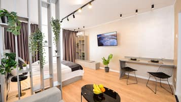 Estudio, 1 habitación, vista a la ciudad | Área de sala de estar