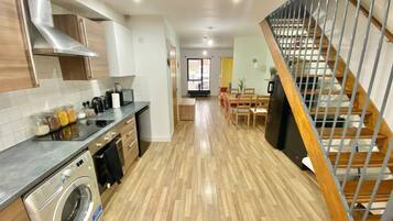 Microwave, coffee/tea maker, dining tables