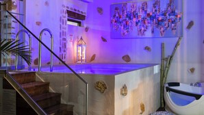 A modern bathroom with a stone wall, a sink, and a mirror. - Villa Splantzia-heated Pool-garden-2 min Chania Port (Chania)