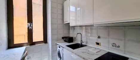 Appartamento, 1 camera da letto, patio | Lavanderia