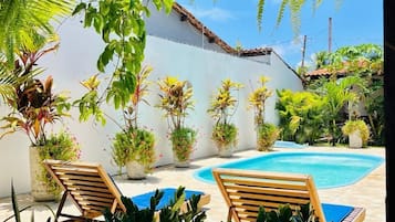 Outdoor pool, open 9:00 AM to 7:00 PM, pool loungers