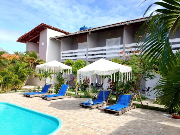 Outdoor pool, open 9:00 AM to 7:00 PM, pool loungers