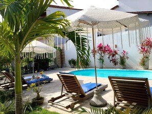 Outdoor pool, open 9:00 AM to 7:00 PM, pool loungers