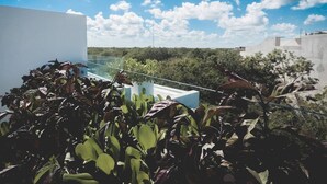A rooftop terrace with a clear view of the sky and surrounding greenery. - Brand New Two Br Penthouse With a Private Roof Patio! Totally Equipped (Tulum)