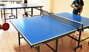 Enjoy a game of table tennis on our indoor table.