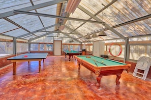 Enjoy a game of pool, billiards, or foosball in this spacious indoor recreation area.