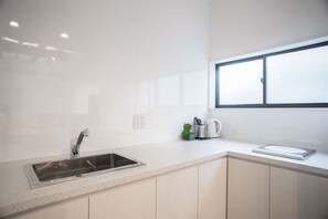 Fridge, microwave, stovetop, cookware/dishes/utensils
