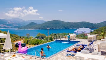 Outdoor pool, open noon to 6:00 PM, pool umbrellas, pool loungers