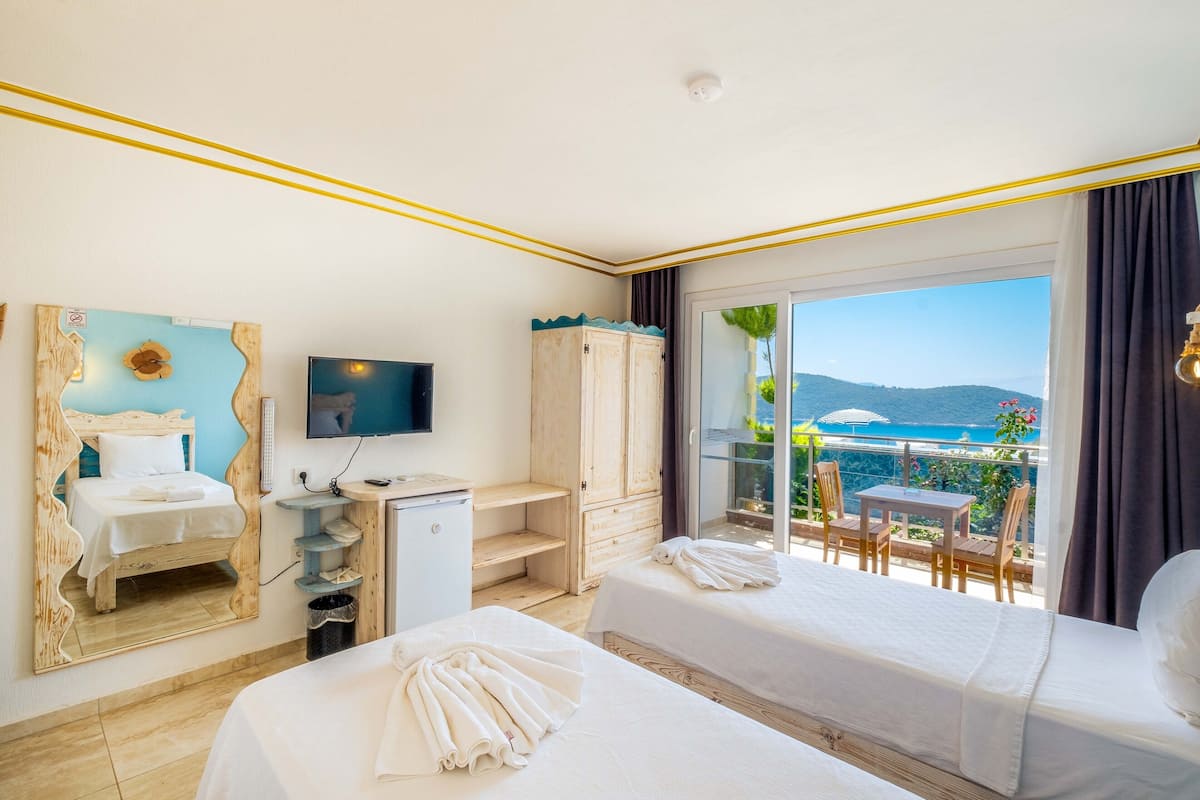 comfort twin room, multiple beds, pool access, partial sea view | 2 bedrooms, premium bedding, minibar, individually decorated