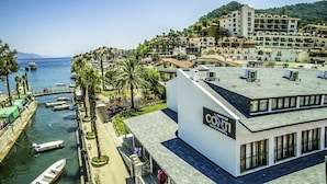 A hotel with a sign reading "Conti Boutique Hotel" on a building with a sloped roof. - Turunc Bay Conti Boutique Hotel (Marmaris)