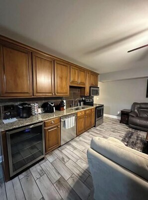 Enjoy cooking in this well-equipped kitchen with oven, microwave, and seating area.