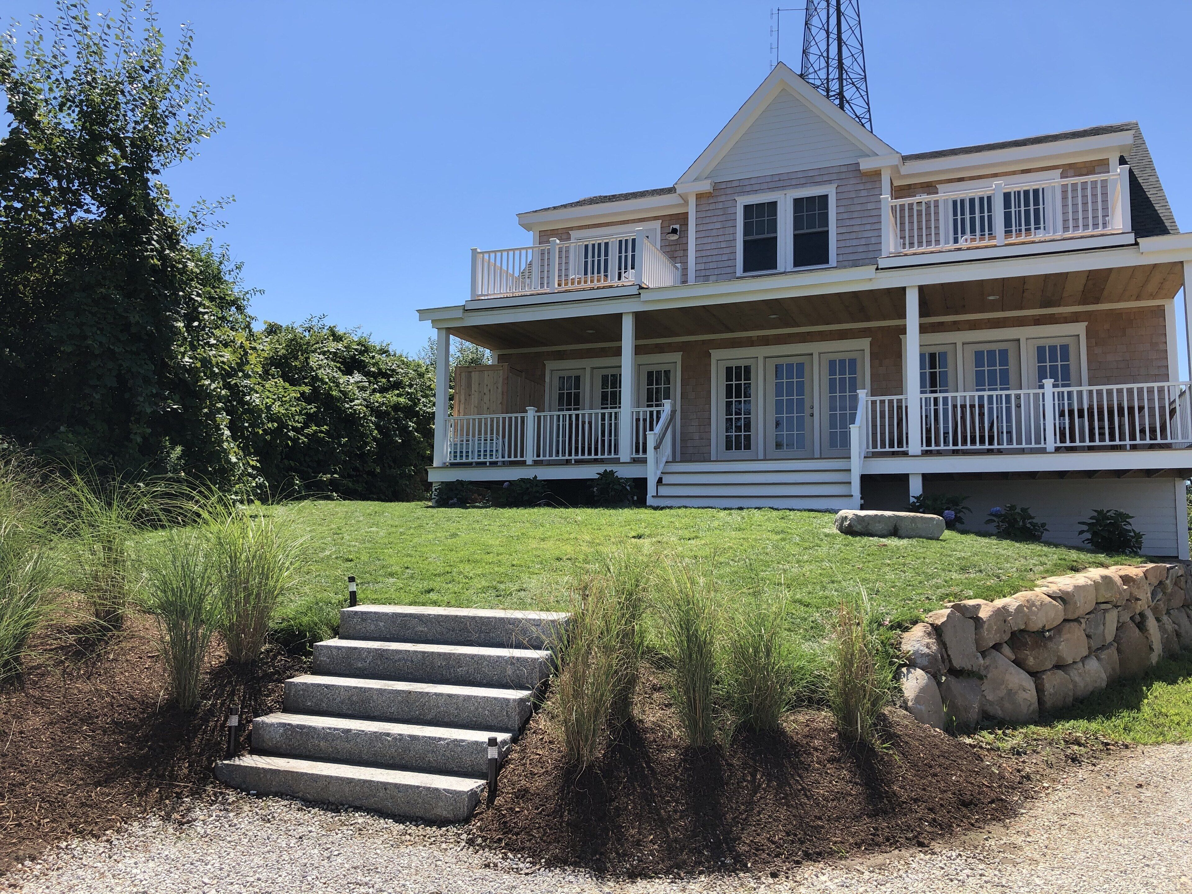 Porch with Rockers and Outdoor Shower. Balconies with Table and Chairs. 