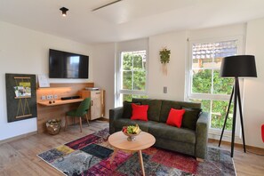 Superior Apartment (1) | Living area | 55-inch Smart TV with cable channels, TV