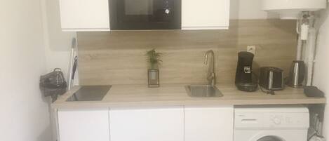 Microwave, stovetop, coffee/tea maker, cookware/dishes/utensils