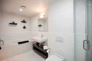 Bathtub, hair dryer, towels, soap