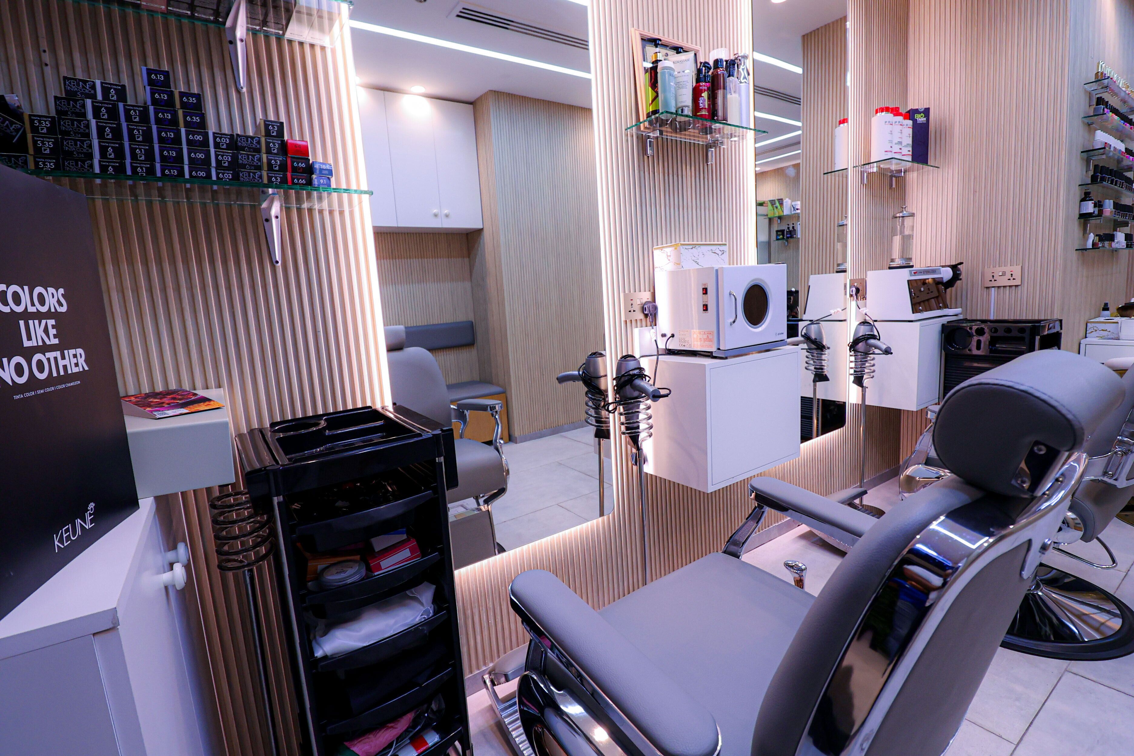 A modern dental clinic interior with a dental chair, shelves with products, and a sign about colors.