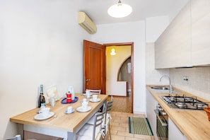 Family Apartment, Multiple Bedrooms (Casa Arno 500m from beach) | Private kitchen | Full-sized fridge, microwave, oven, stovetop