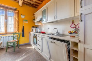 Family House, Multiple Bedrooms, Mountainside (Casale Geniva with private pool) | Private kitchen | Full-sized fridge, microwave, oven, stovetop - Casale Geniva (Massarosa)