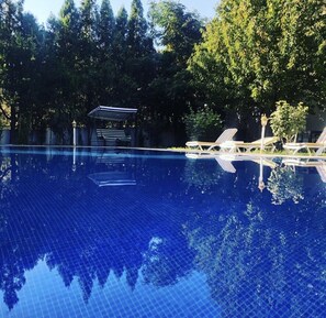 Outdoor pool, pool umbrellas, sun loungers