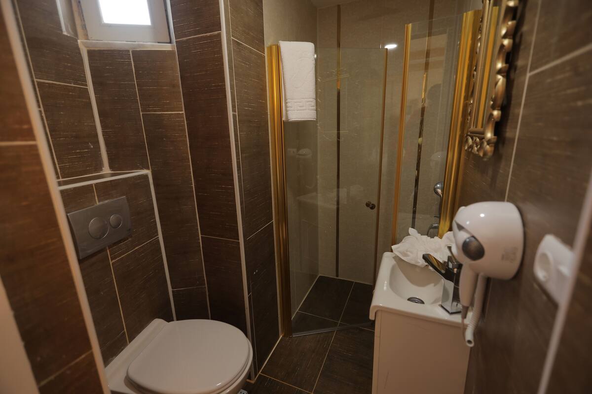 Shower, rainfall showerhead, designer toiletries, hair dryer