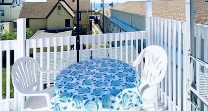 Ocean Views, seconds to the beach, and a 5 minute walk to downtown shopping!