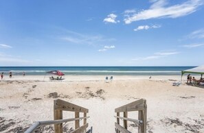 On the beach, sun-loungers, beach towels