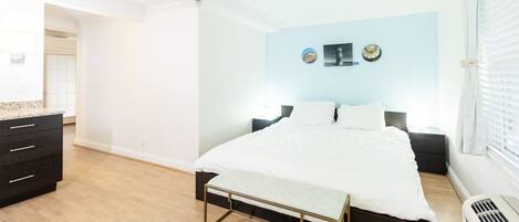 1 bedroom, desk, iron/ironing board, travel crib