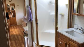 Shower, towels, soap, toilet paper
