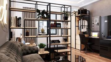 Monolocale Deluxe | Area soggiorno | TV a schermo piatto 32 pollici con canali via cavo, TV