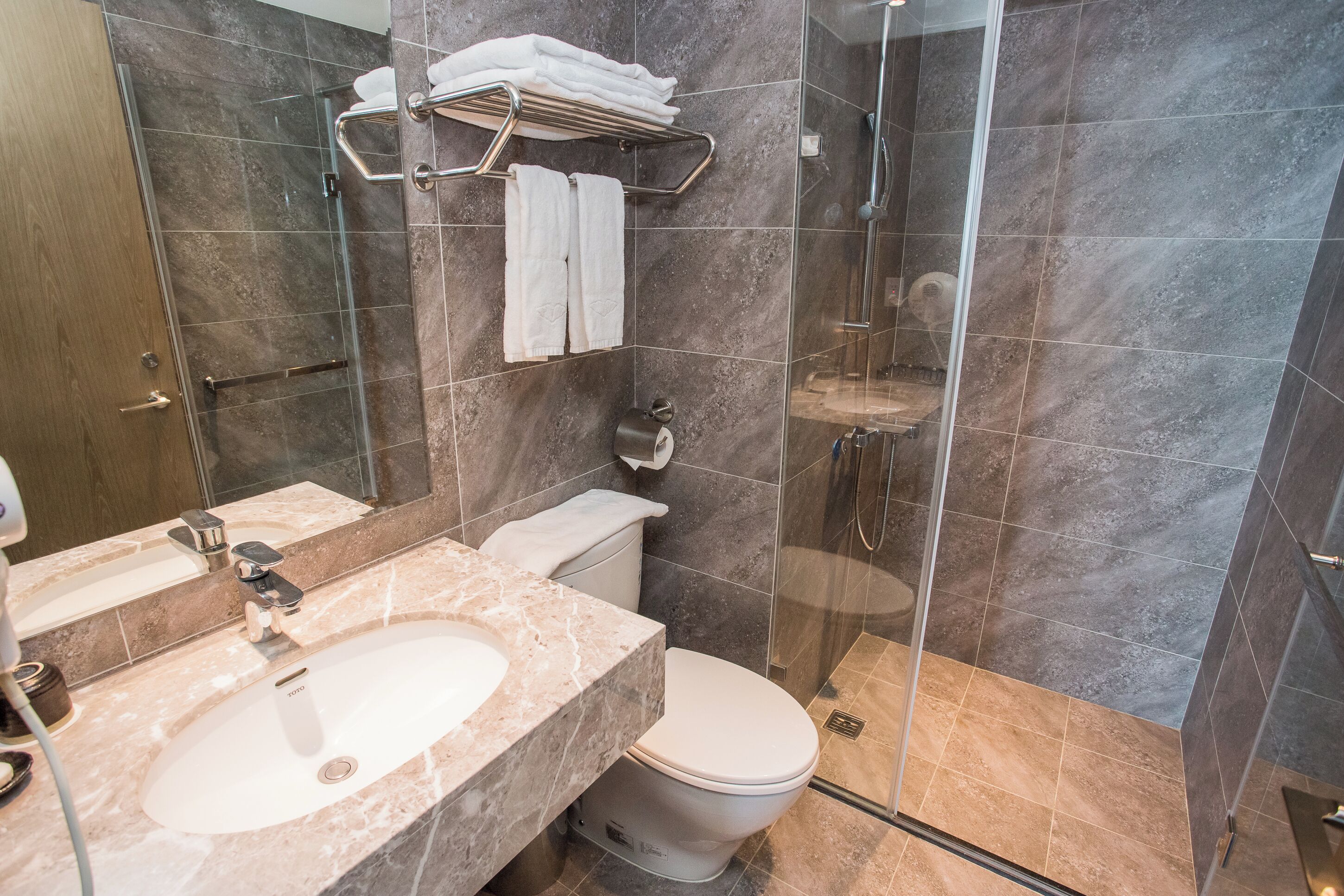 family duplex (no bathtub) | bathroom | shower, free toiletries, hair dryer, slippers