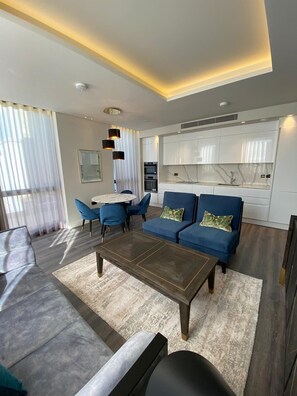 Deluxe appartement | Woonruimte | Flatscreentelevisie