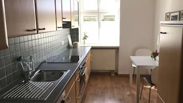 Comfort Apartment | Private kitchen | Fridge, dishwasher, coffee/tea maker, cookware/dishes/utensils