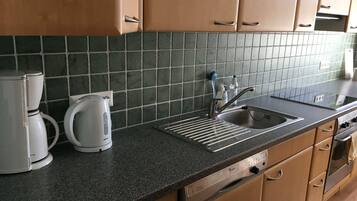 Comfort Apartment | Private kitchen | Fridge, dishwasher, coffee/tea maker, cookware/dishes/utensils