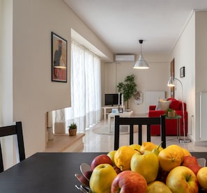 Apartment, 1 Bedroom | Living area | 20-inch flat-screen TV with cable channels, Smart TV